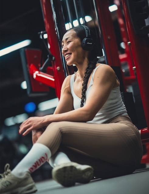 Woman seated at gym machine