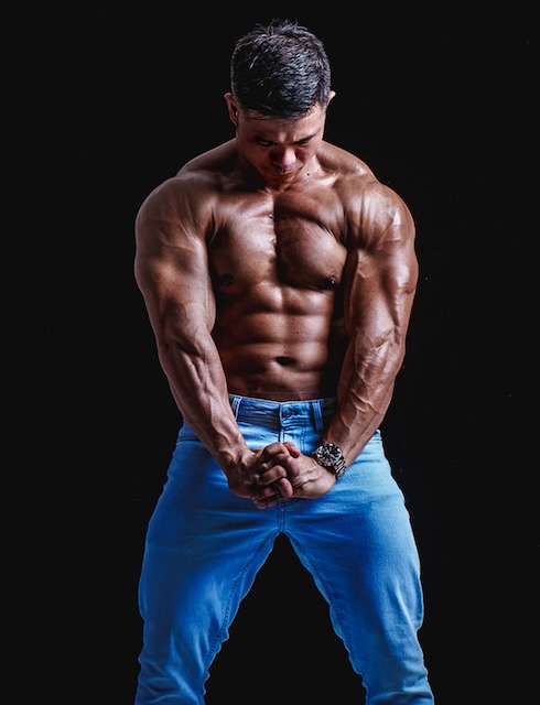 Shirtless man in blue pants