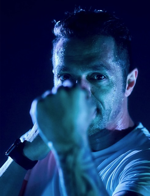 Man lit in blue light